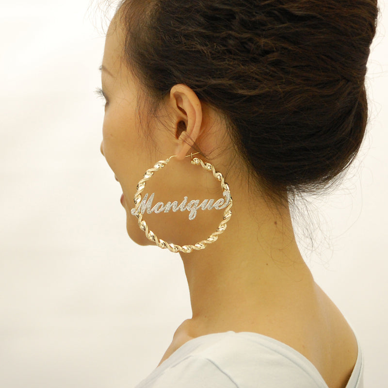 Model wearing 3 inch large 10K gold two tone iced out custom name hoop earrings