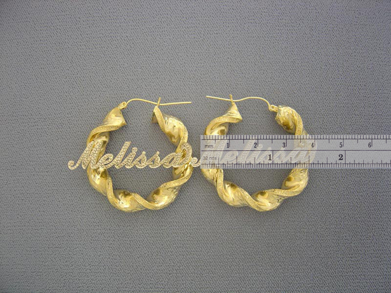 Pair of 10K gold 8mm twisted round hoop earrings with secure hinged snap lock closure