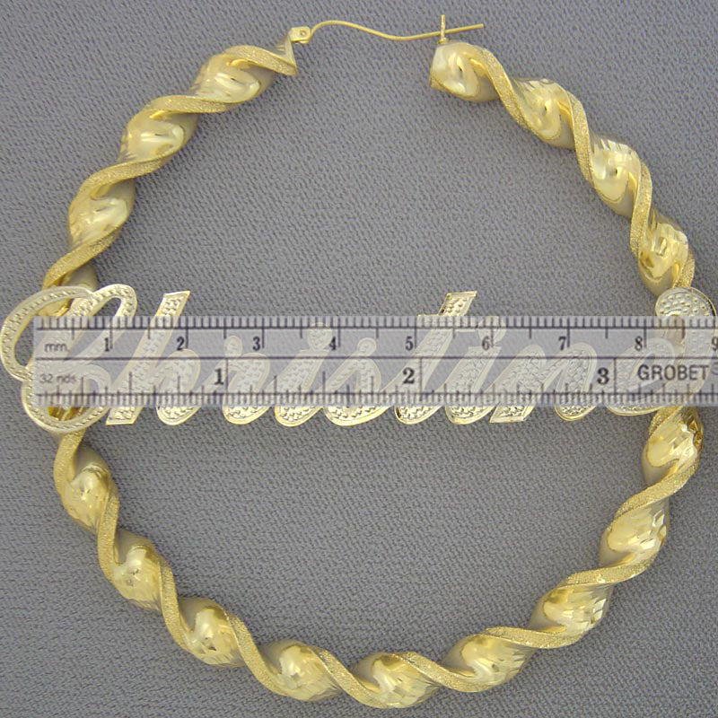 Hinged snap closure on extra large 3.5 inch 10K gold twisted hoop earrings