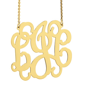 Gold monogram necklace on a white background