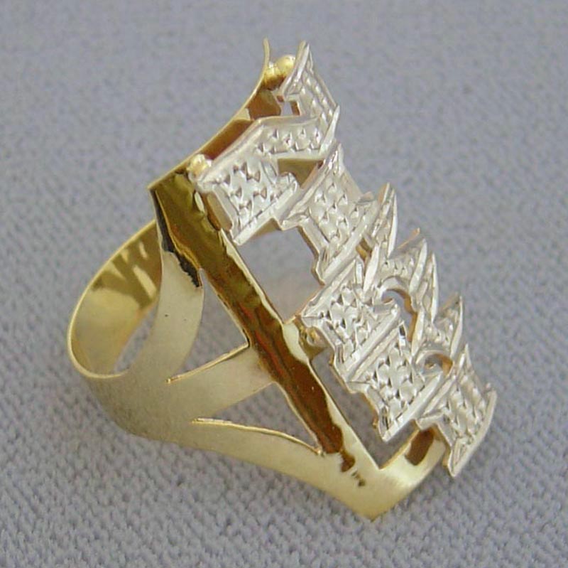 Close-up of handmade two-tone gold personalized name ring showing diamond-cut rhodium shine and custom lettering detail