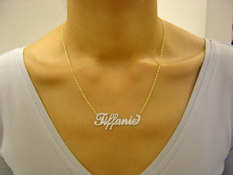Personalized 14k gold two-tone nameplate necklace on a 10k gold chain