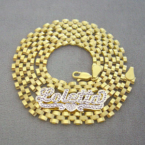 Close-up of hand-engraved 3D iced out nameplate with 10K gold watch-band link chain