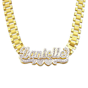 Personalized 10K yellow gold iced out nameplate necklace on an 8mm watch-band link chain displaying Danielle