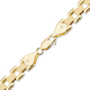 Detailed shot of high-polish Rolex-style presidential watch band chain links in 10K yellow gold