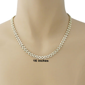 Model wearing a 10K yellow gold 6mm Presidential watch band link chain necklace