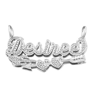 Custom sterling silver 3D nameplate necklace spelling "Desired" featuring a Cupid’s arrow piercing through twin heart accents, hand-carved diamond-cut finish, and a double-plate design.