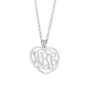 Woman wearing a personalized sterling silver 3-initial heart monogram pendant necklace.