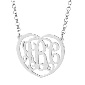 Personalized 1.25-inch sterling silver heart monogram pendant featuring intricate cursive 3-initial lettering on a silver chain.