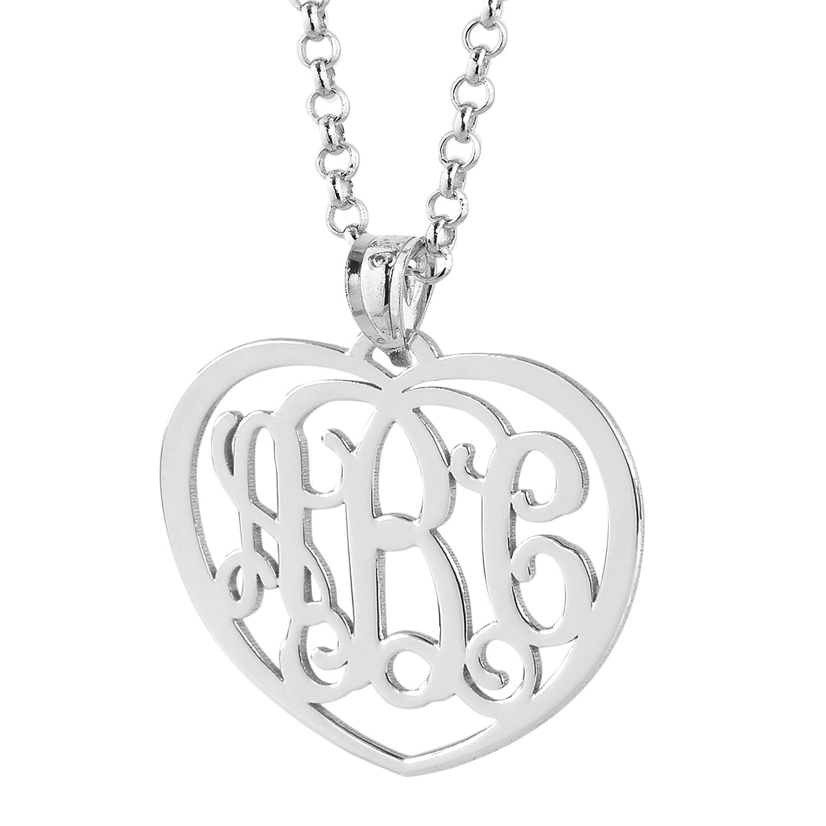 Close-up view of the polished sterling silver heart-shaped monogram pendant on a silver chain link.