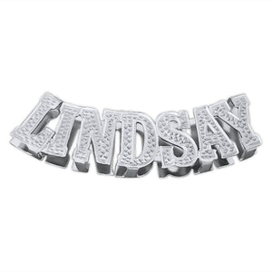 Personalized sterling silver 3D nameplate pendant reading "LINDSAY" with diamond-accented block lettering on a polished finish.