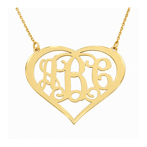 Custom 3-initial solid gold heart monogram necklace with a gold chain on white background.