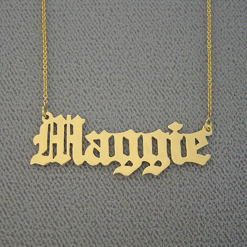 Custom handcrafted Old English Gothic style solid gold name necklace pendant display.