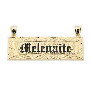 Rectangular solid 14k yellow gold Hawaiian name pendant with 'Melenaitie' hand-engraved in Old English font with black enamel fill.