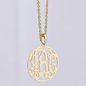 Extra-small solid gold 3-initial circle monogram pendant necklace on a light gray background.