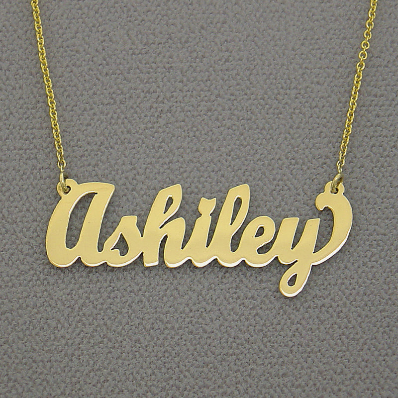 Close-up of custom script gold nameplate pendant attached to an adjustable chain.