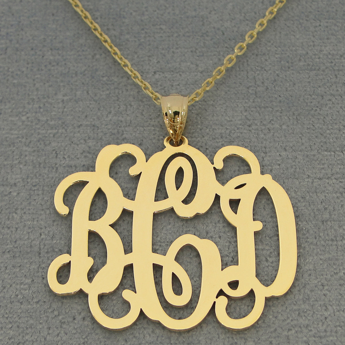 Handcrafted solid gold personalized monogram jewelry made in Los Angeles, California.