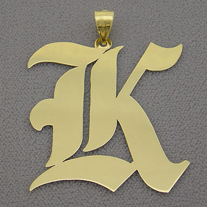1Close-up view of the handcrafted Old English letter K gold pendant charm displaying detailed beveling and mirror shine finish.