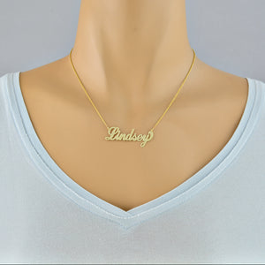Model wearing a 16-inch personalized 10k gold script font name necklace