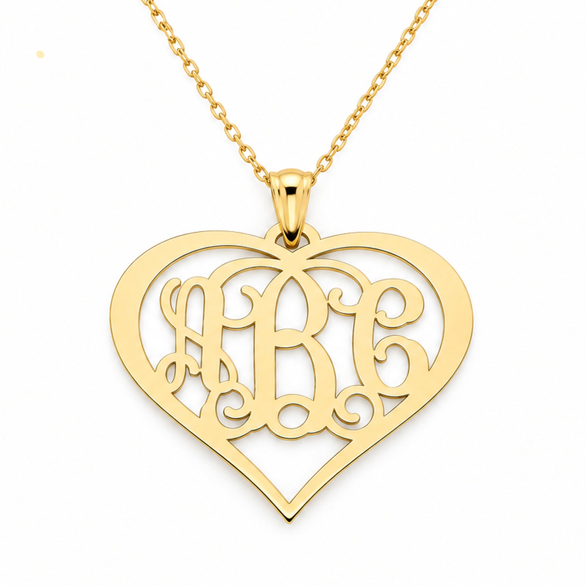 Personalized 10K or 14K solid gold three-initial heart monogram pendant on a white background