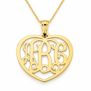 Personalized 3-initial solid gold heart monogram pendant necklace on a yellow gold chain against a white background