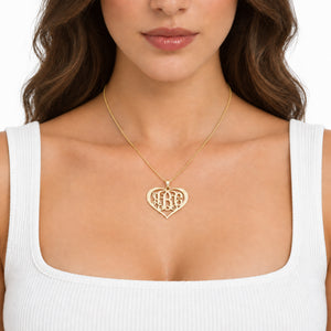 Personalized 3-letter solid gold heart monogram pendant.