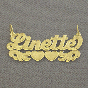 Custom solid gold check-pattern name pendant spelling Linette with double heart underline flourish.