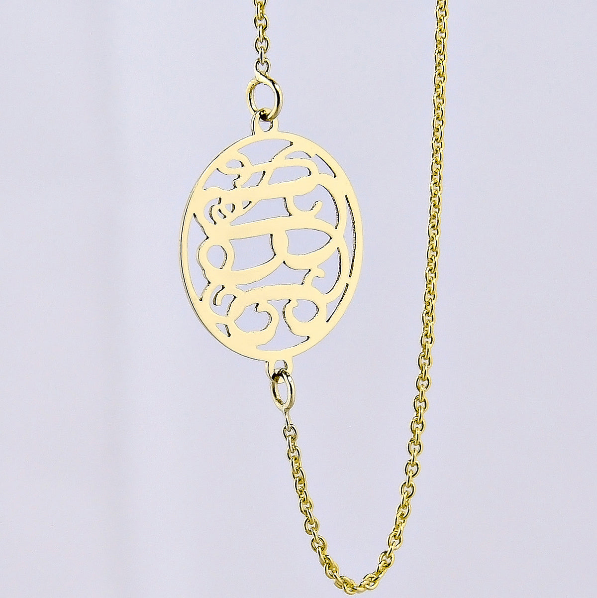 Personalized solid gold circle monogram pendant necklace with a delicate gold chain