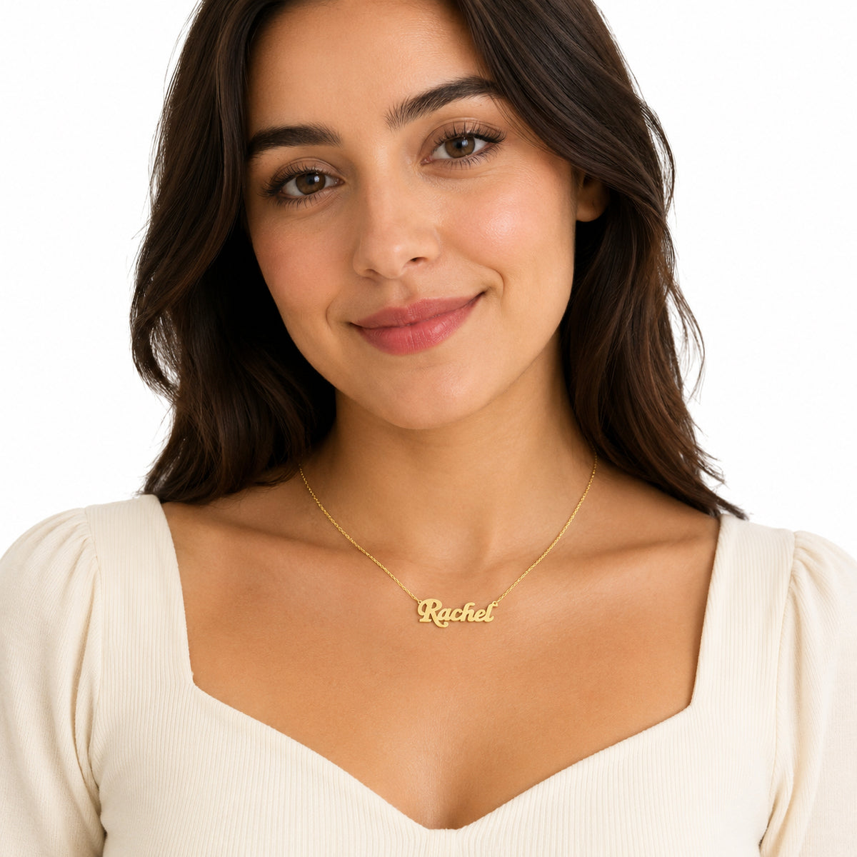 Woman wearing a small solid gold script nameplate necklace spelling Rachel on a Singapore twist chain.