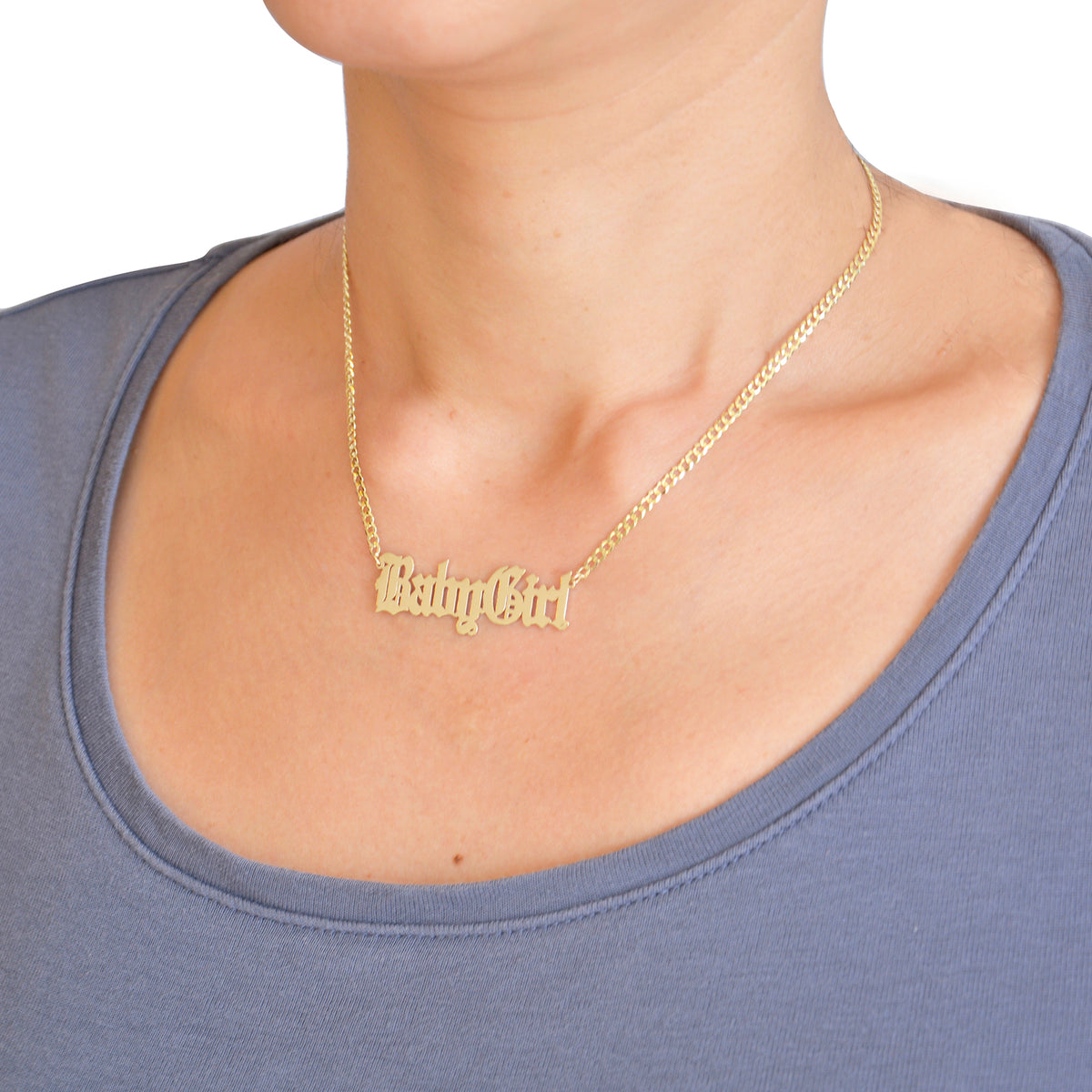 Solid 10k yellow gold gothic font nameplate pendant with a 3.0mm Cuban link chain on display model.