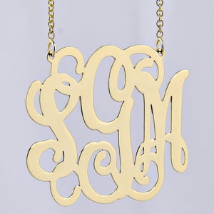 Detailed view of a custom 10k or 14k solid gold 3 initial monogram pendant