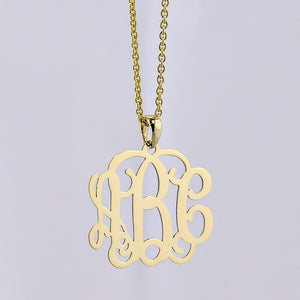 Back view of mini 3-initial monogram pendant showing authentic solid gold quality stamp.