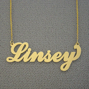 Handcrafted custom 14k yellow gold script font name necklace cutout close-up