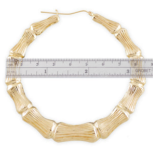 Close up of 10k gold bamboo texture pattern and latch closure on hoop earrings