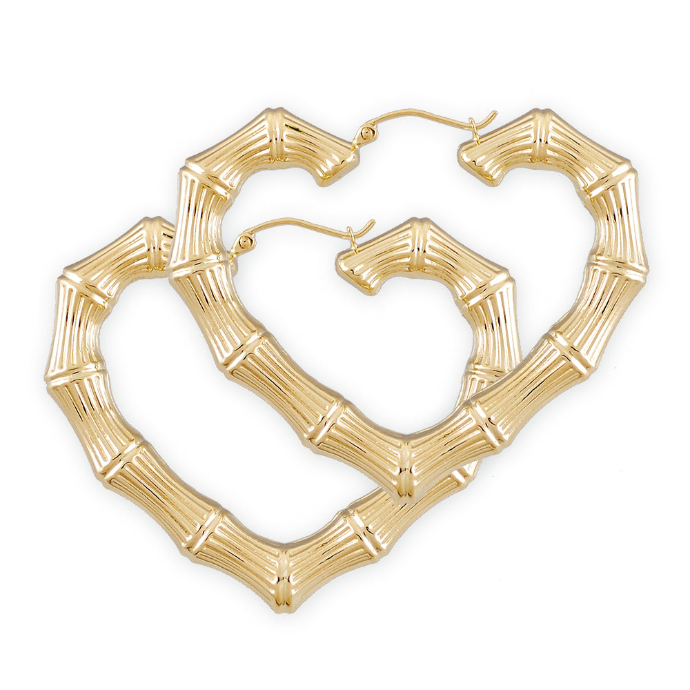A pair of gold hollow heart bamboo earrings, 2 inches wide, with a door knocker design.