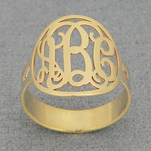 Side angle of 5/8 inch (15mm) solid gold customized circle monogram ring showing intricate detail and polish.