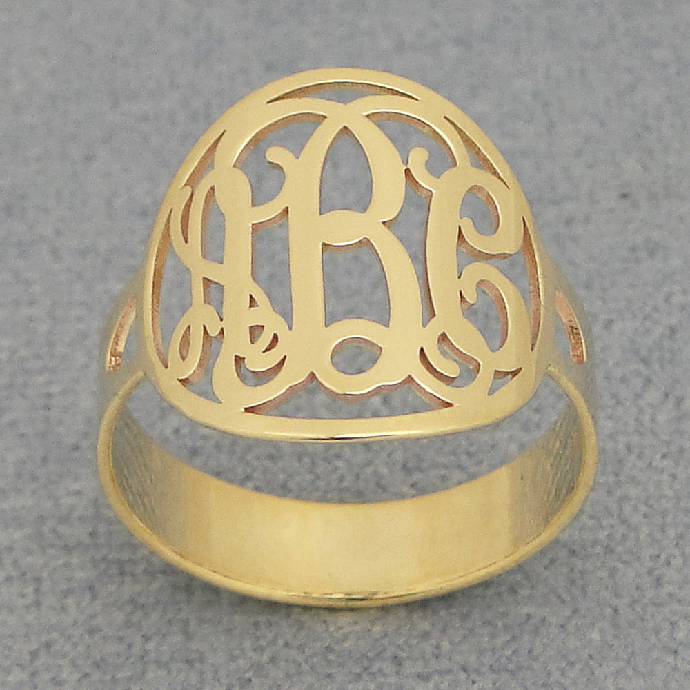 Side angle of 5/8 inch (15mm) solid gold customized circle monogram ring showing intricate detail and polish.