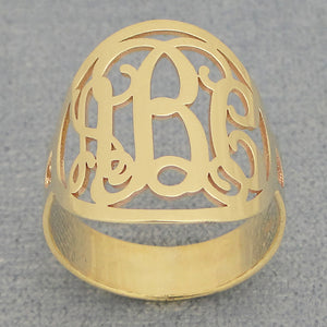 Solid 14k gold custom circle monogram ring showing polished finish and band thickness