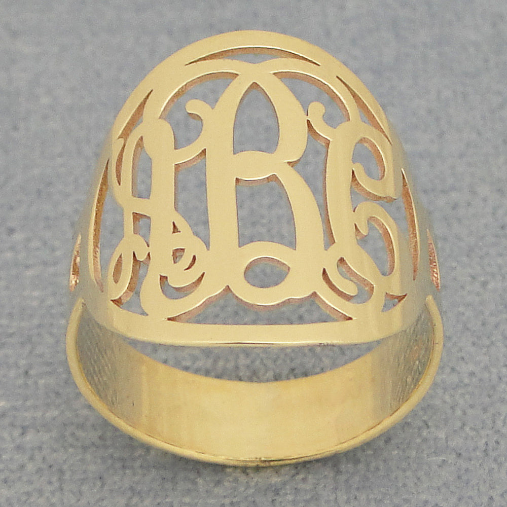 Solid 14k gold custom circle monogram ring showing polished finish and band thickness