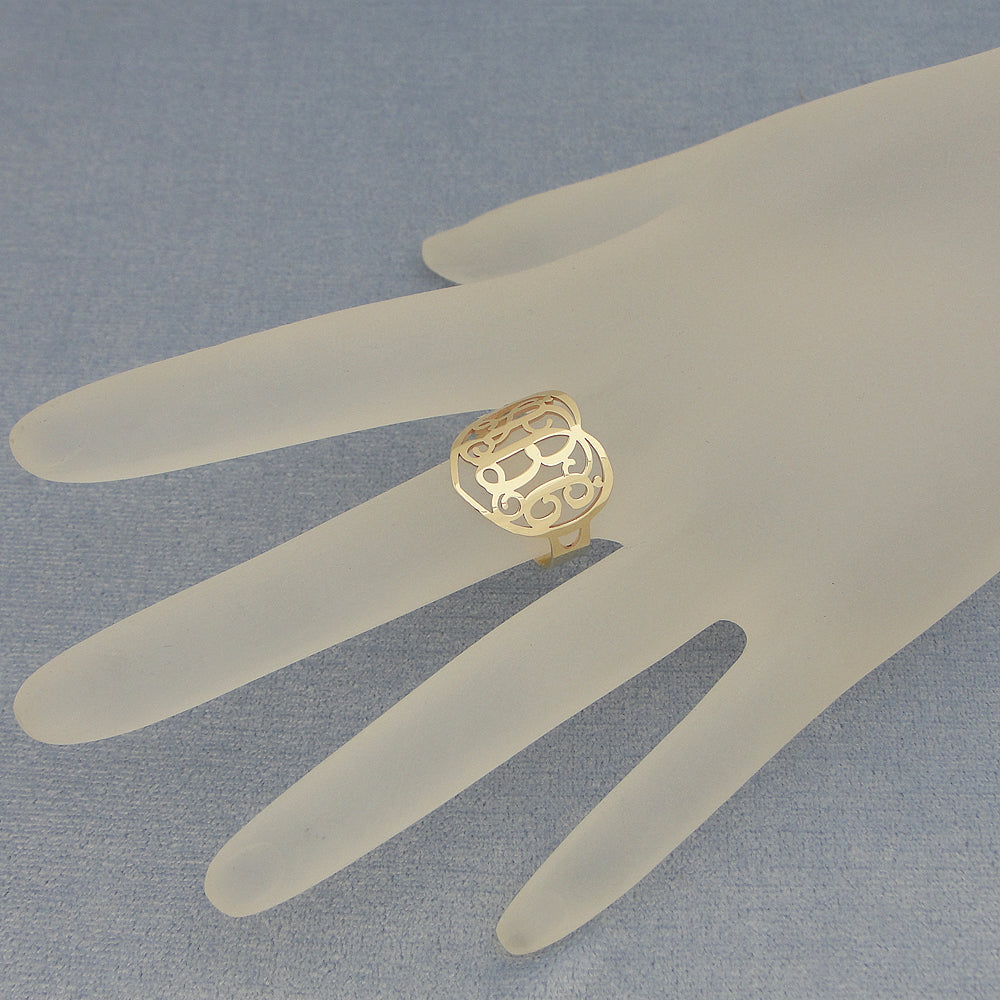 Custom 10k solid gold heart-shaped monogram ring worn on finger