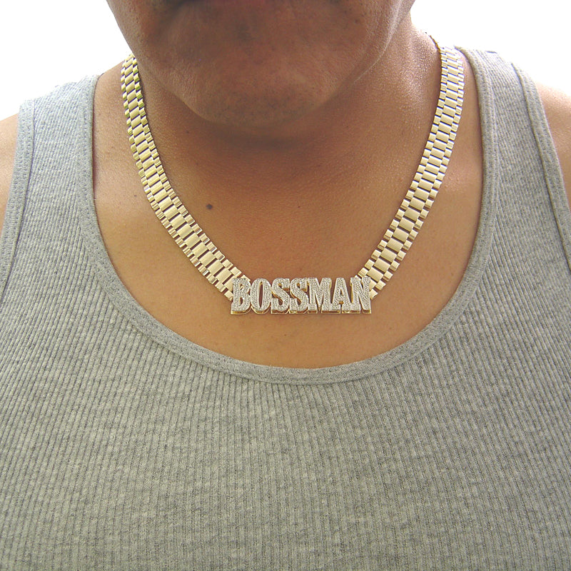 Model wearing a 10K solid yellow gold watch-band link chain with a custom iced-out nameplate.