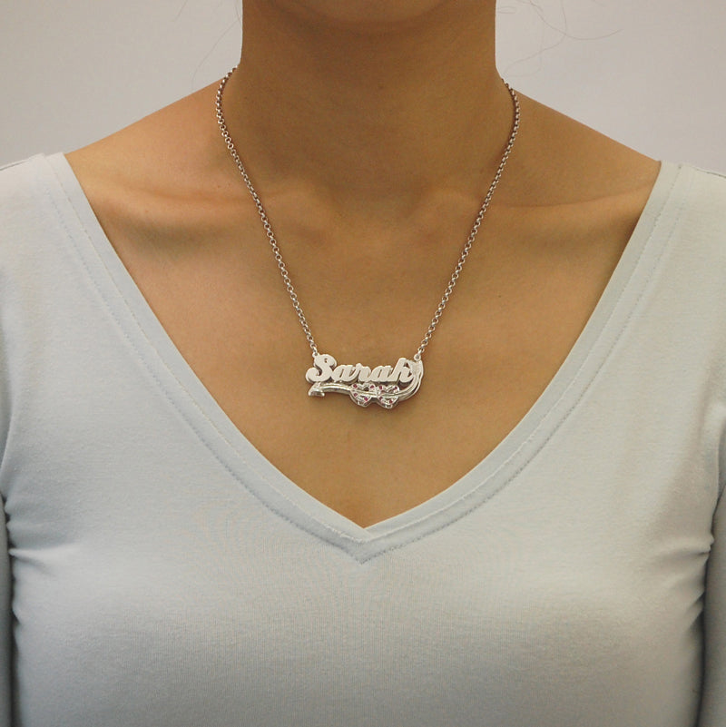 Model wearing the personalized sterling silver Sarah 3D double plate nameplate necklace attached to a Rolo chain.