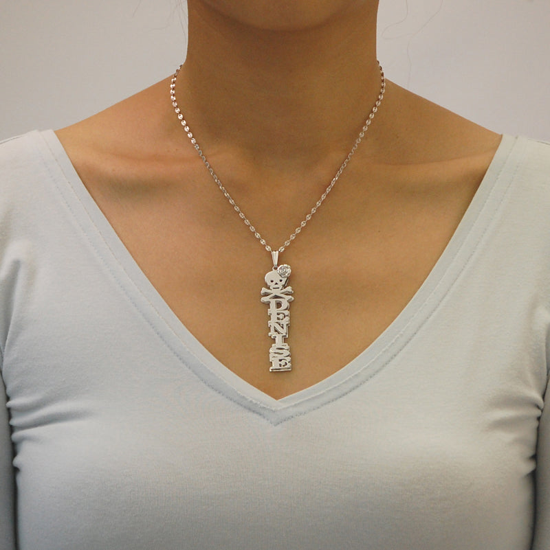 Model wearing a custom vertical silver name pendant reading "DENISE" on an 18-inch rolo chain.
