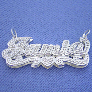 Personalized 3D double plate sterling silver nameplate pendant featuring custom name Jamile with a heart motif, cursive lettering, and diamond-cut accents.