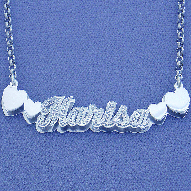 Personalized sterling silver 3D double plate nameplate pendant spelling "Marisa" with side heart accents and diamond detailing.