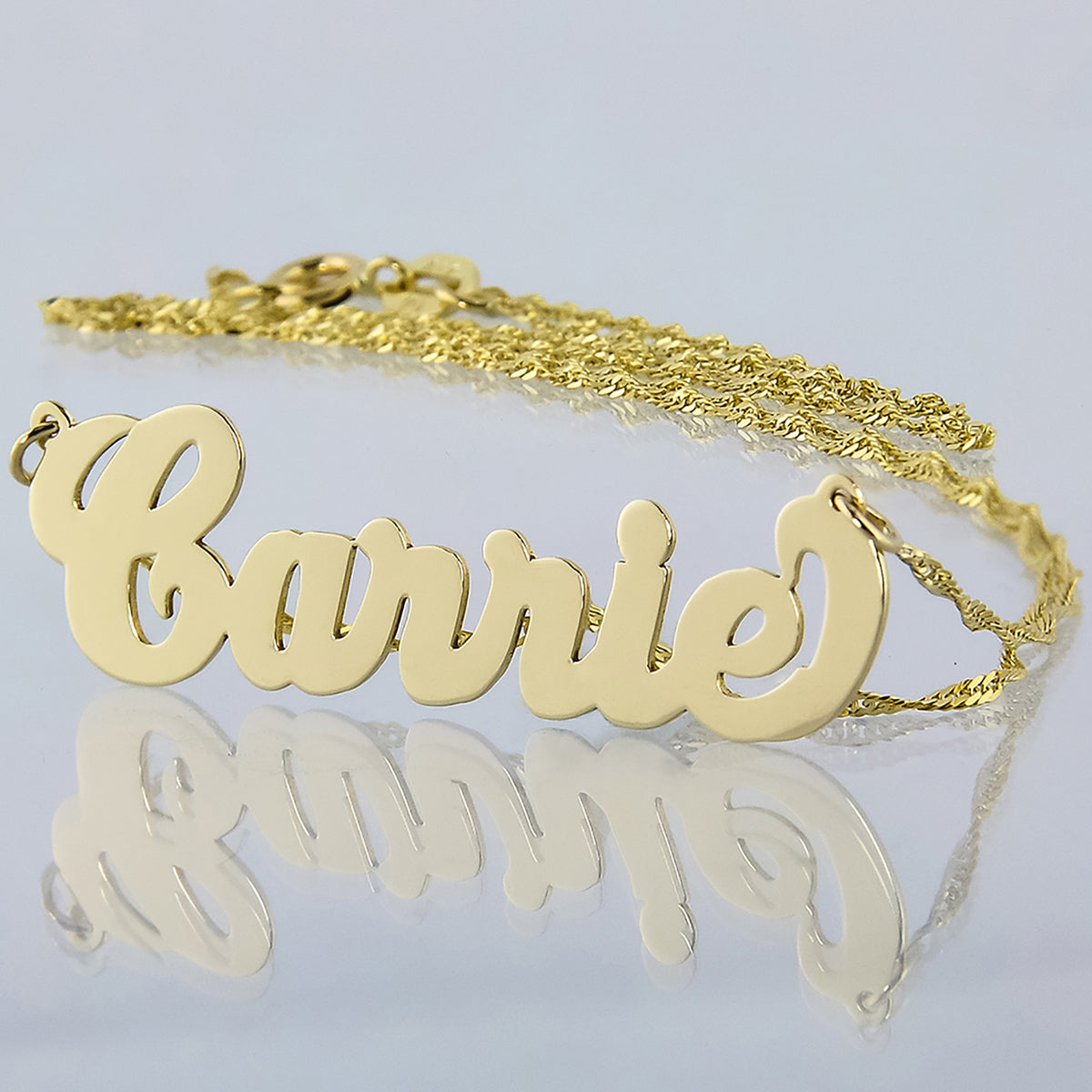 Handcrafted custom small 10k gold Carrie script name necklace on a fine Singapore chain.