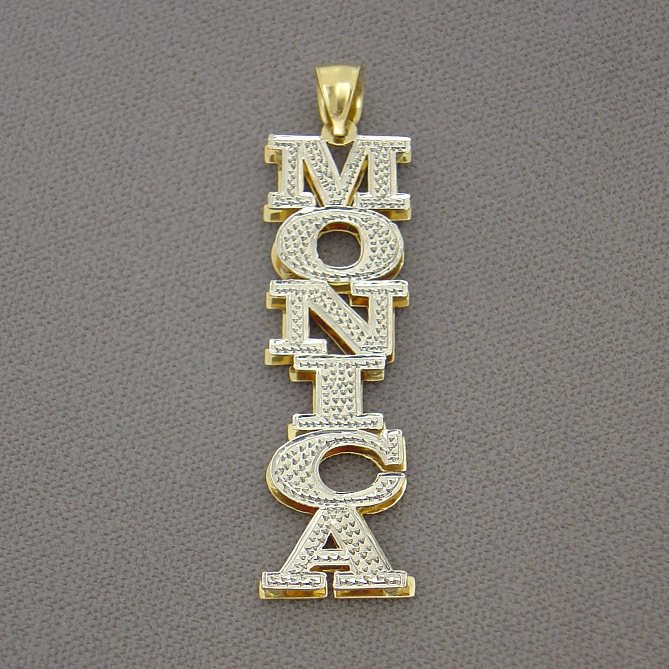 Back view of custom 3D double plate vertical gold name pendant showing official gold hallmarks