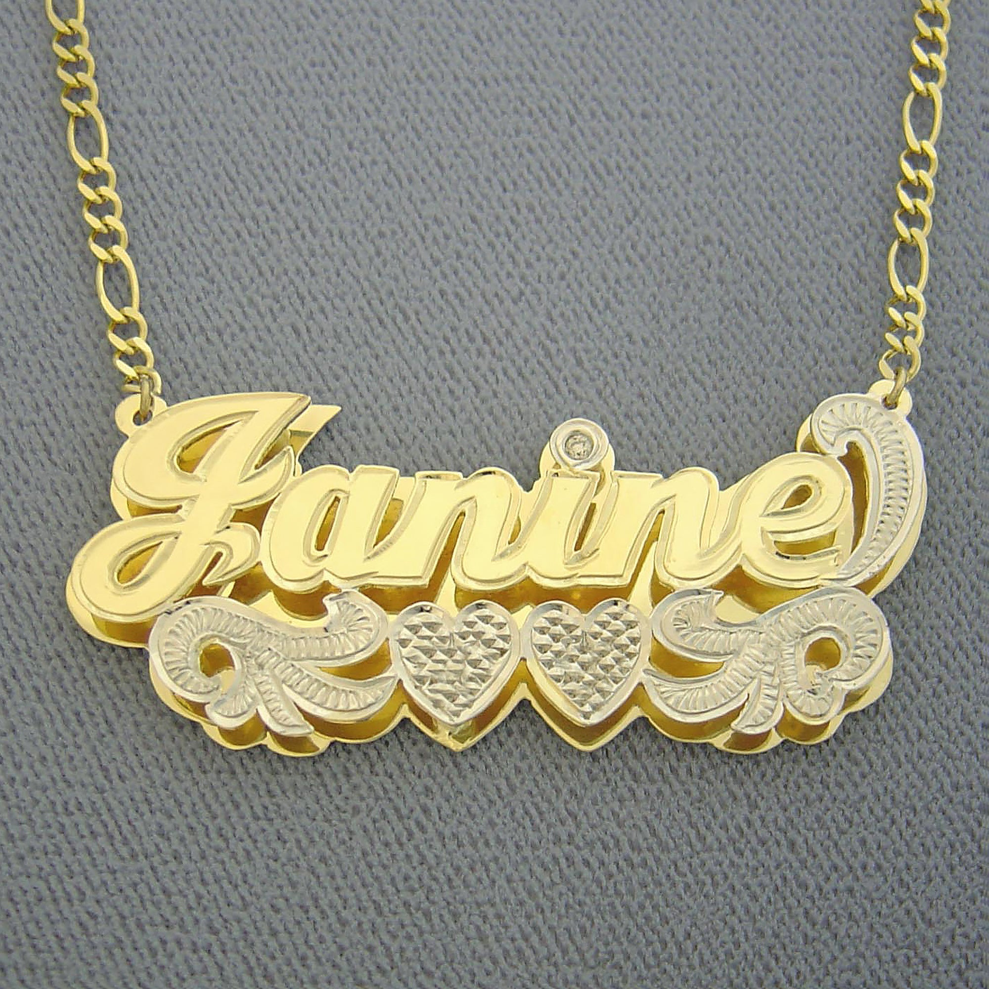 Front close-up view showing the double-plate design and laser-cut detail of the custom 3D gold nameplate.