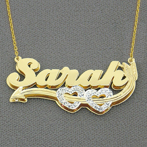 Personalized two-tone 3D gold name charm with hand-carved rhodium diamond-cut accents made in Los Angeles, USA.