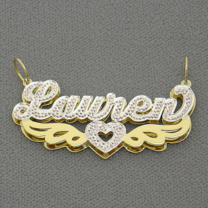 Close up of hand carved iced out white rhodium diamond accents on custom 14k two tone nameplate pendant.